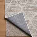 Back corner of Townes Pebble Beige Rug lifted to reveal non-slip rug pad underneath