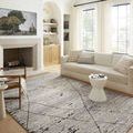 Fabian Grey Charcoal Rug styled in a bright living room with light sofa and large windows