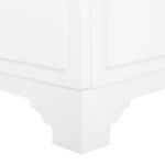 Close-up corner view of beveled leg with subtle cutout design in white lacquer finish