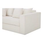 Close-up of left-front corner highlighting textured fabric and cushion depth