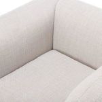 Bird's-eye view of cushioned seating area bordered by thick curved armrests