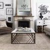 Living room overview showing Loren Sand Taupe Rug with white cabinetry and black sculpture on sideboard