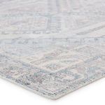 Close-up angled view highlighting cut-loop pile texture and soft color gradients on rug