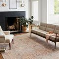 Jules Tangerine / Mist rug in living room with beige and neutral-toned furniture and natural light