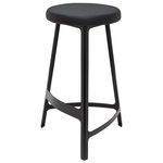 Hyku Counter Stool with sleek black finish, round cushioned seat, and triangular metal legs with footrest