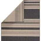 Backside of the rug folded to reveal reverse stripe pattern in muted gray and beige colors