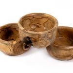Group of three Meno Outdoor Bowls stacked, highlighting the varying shapes and knot features