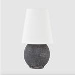 Ulsterville table lamp with dark gray textured ceramic base and white linen shade on plain background