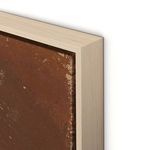 Close-up of light wood frame corner featuring texture and worn areas on brown paint canvas edge.