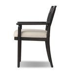Side profile highlighting slender legs and cushioned seat thickness of Tova Dining Armchair