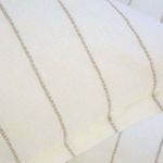 Close-up of interwoven stripe texture in Blake White/Natural duvet fabric with visible linen weave
