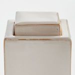 Top view focusing on fitted square lid with glossy cream glaze and subtle brown accents