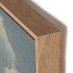 Close-up of the thick wooden frame corner highlighting grain and layering around the canvas edge