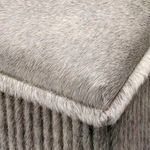 Close-up of soft textured hair-on-hide upholstery showing detail on the cushioned seat and ribbed side