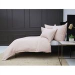 Side view of bed with Waverly Big Pillows and duvet showing pillow arrangement and room contrast