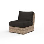 Armless outdoor accent chair with premium all-weather wicker in aged tobacco and dark cushioned seat and back