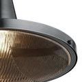 Close-up of metal and glass junction with visible screws and textured wave pattern on diffuser