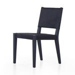 Villa Dining Chair angled side view with smooth black upholstery and tapered legs