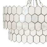 Close-up on hexagonal capiz seashell panels with metal framing on chandelier
