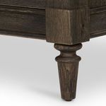 Detail of turned leg in weathered chestnut wood with subtle carved accents