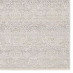 Close crop of rug corner highlighting intricate vintage-inspired floral pattern