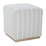 Three-quarter angle view showing cube shape and striped fabric detail on Dena Ottoman