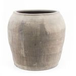 Vintage large pottery jar in light tan color with subtle darker brush marks and smooth texture viewed from side