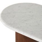 Rounded acacia leg viewed from an angle with focus on smooth wood grain and finish
