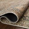 Rolled edge close-up showing the rug's weave, thickness, and backing material