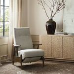 Jarvis Recliner styled in a light filled room with decorative vase on wood sideboard and rug underneath