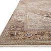 Side angle of the rug showing its thin profile and fine edge binding