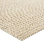 Angled close-up showing texture and thickness of jute and wool fibers
