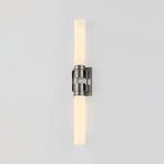 Glen Oaks Wall Sconce lit with both glass cylinders glowing warmly on a light background