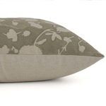 Side profile highlighting natural linen fabric texture and muted sage floral design of the pillow cover