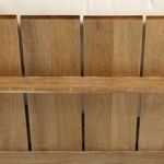 Detailed view of teak wood slats on sofa back with visible wood texture and grain