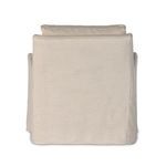 Back view revealing full natural linen slipcover extending to floor without visible legs