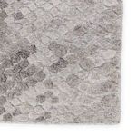 Close-up showing pebble-like geometric texture and subtle taupe accent details