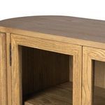 Straight-on front view of sideboard highlighting symmetrical design and glass-paneled doors