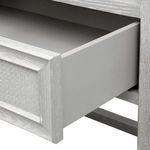Open drawer showing smooth gray painted interior and cerused oak surrounding frame