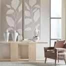 Westwood Console Table styled in a modern room setting with decorative vases, books, and floral wall art