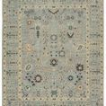 Blue and green hand-knotted wool rug with washed floral Old World pattern and decorative border