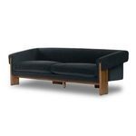 Repeat of front view sofa image showing tight upholstered design and wooden legs