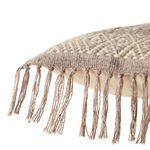 Close-up detail of tassels and woven texture on pillow edge showing thick yarn strands