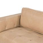 Corner close-up of tufted seat cushion and back cushion junction