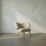 Valerie Chair with curved Ocean Grey fabric back, plush seat cushion, and angled Sungkai/Mindi wood legs in Charcoal Black...