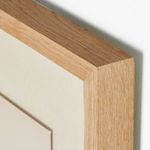 Close-up angle of natural oak frame corner with cream matte inside