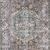 Close-up of Layla Taupe / Stone rug rolled up to show backing and flexible polyester material