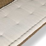 Detail of rattan weave and cushion edge stitching on Senna woven bench