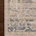 Top detail of Milena rug corner highlighting vintage floral border and soft color variation.