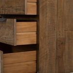 Close-up of iron leg on darker-stained dresser with flat tapering and sturdy construction
